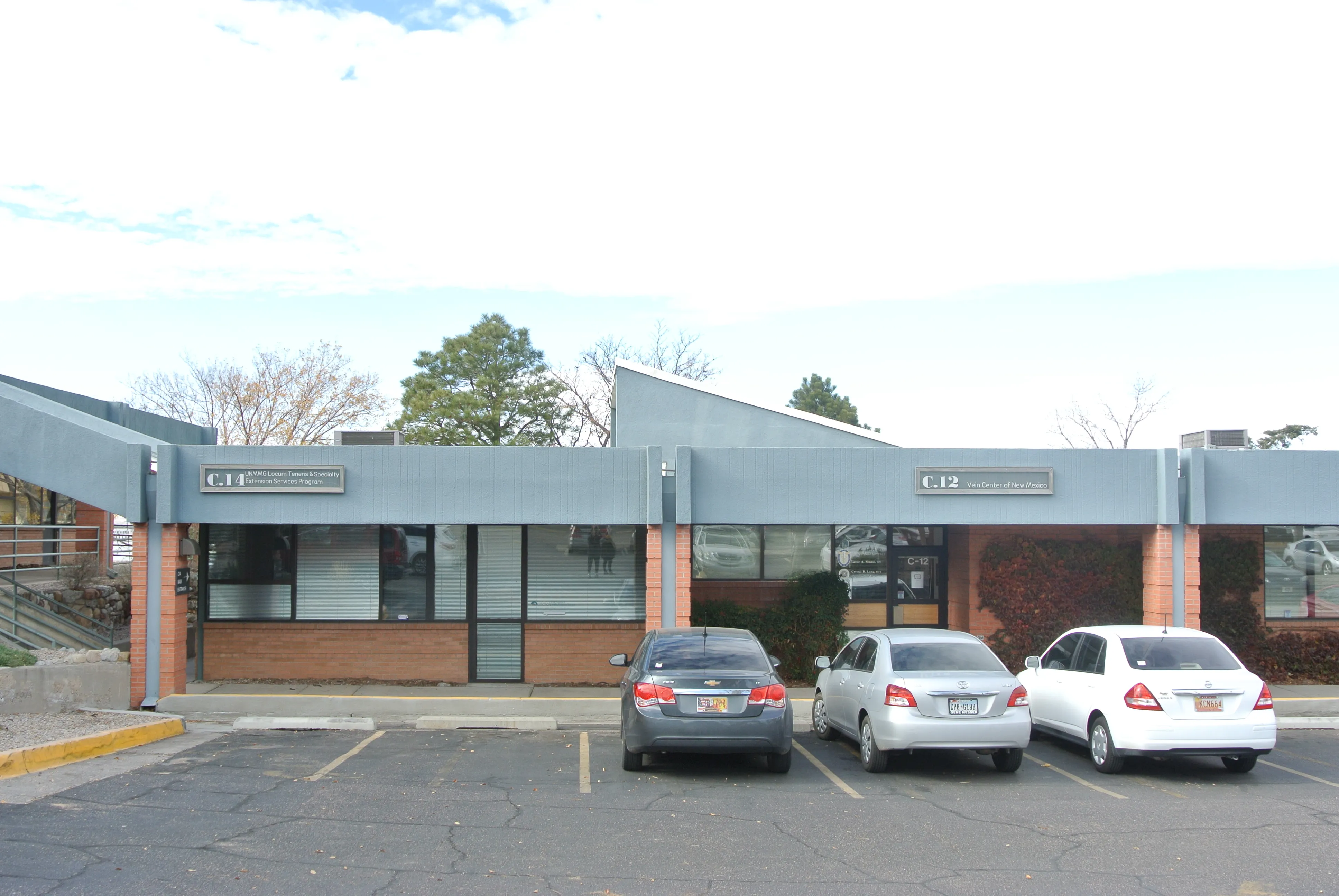 View of façade from parking lot showing skylight